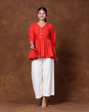 Vibrant Rust Peplum & White Culotte Set.
